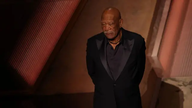Morgan Freeman in a black velvet suit on the Oscars stage
