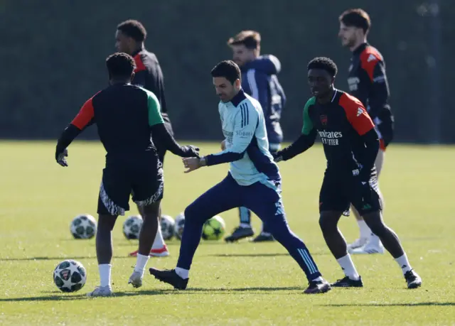 Arsenal's Ismeal Kabia and manager Mikel Arteta during training