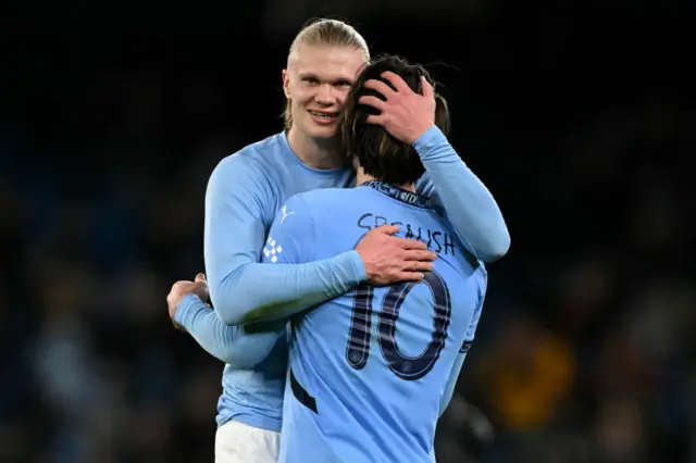 Erling Haaland celebrates with Jack Grealish after scoring against Plymouth Argyle