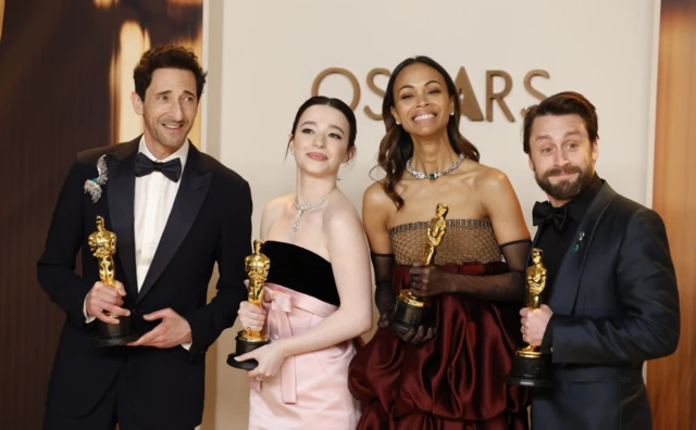 Adrien Brody, winner of the Best Actor in a Leading Role for "The Brutalist", Mikey Madison, winner of the Best Actress in a Leading Role for "Anora", Zoe Saldana, winner of the Best Actress in a Supporting Role for "Emilia Perez", and Kieran Culkin, winner of the Best Actor in a Supporting Role for "A Real Pain", pose in the press room