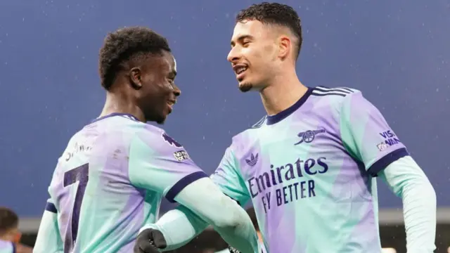 Arsenal's Bukayo Saka celebrates scoring with team-mate Gabriel Martinelli.
