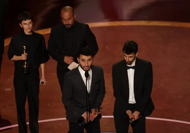 Basel Adra, Rachel Szor, Hamdan Ballal and Yuval Abraham accept the Oscar for Best Documentary Feature Film