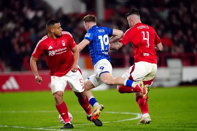 Ipswich Town's Liam Delap goes down under pressure from Nottingham Forest's Murillo.