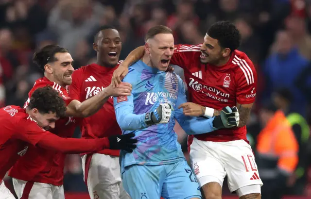 Nottingham Forest's Matz Sels and Morgan Gibbs-White with teammates celebrate after the match.