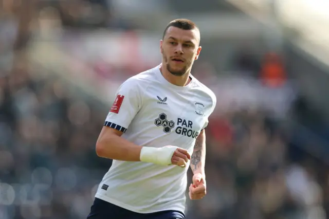 Preston striker Milutin Osmajic looks on