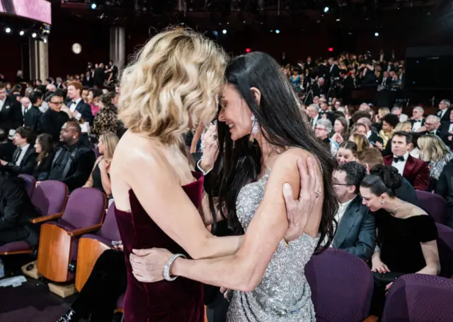 Meg Ryan and Demi Moore embrace at the ceremony