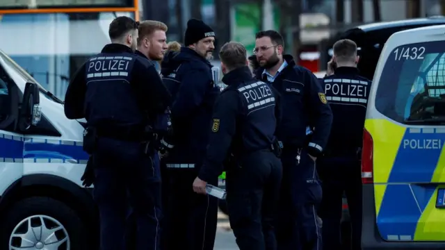 Several police officers gathered at the site of the incident.
