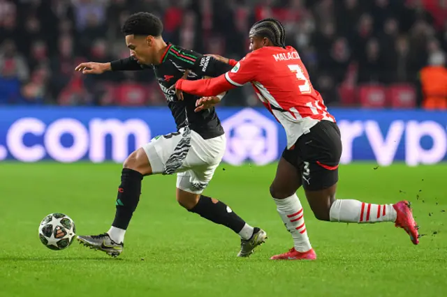 Ethan Nwaneri fights for the ball with PSV Eindhoven's Dutch defender Tyrell Malacia