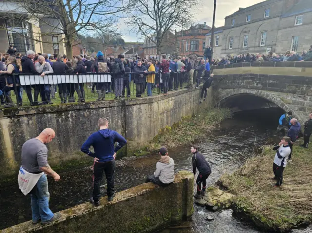 People near the river