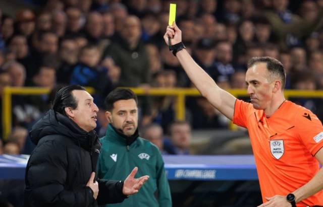 Aston Villa manager Unai Emery is shown a yellow card