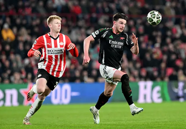 Declan Rice of Arsenal is challenged by Jerdy Schouten