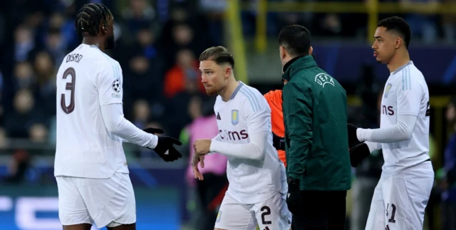 Aston Villa's Matty Cash comes on as a substitute to replace Aston Villa's Axel Disasi as Aston Villa's Jacob Ramsey looks on f