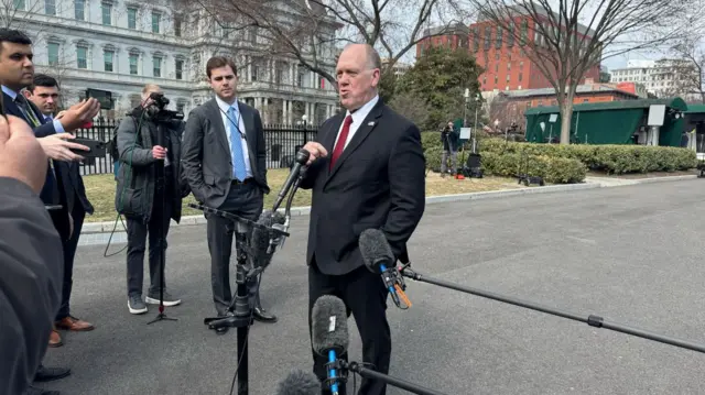 Tom Homan speaking into microphone outside of the White House