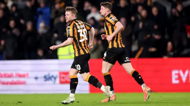 Joe Gelhardt smiles after scoring against Plymouth