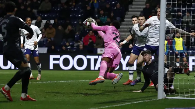 Swansea's Lawrence Vigouroux makes a save