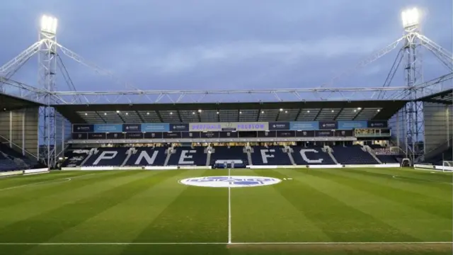 An empty Deepdale with the floodlights on ahead of their Championship game against Swansea