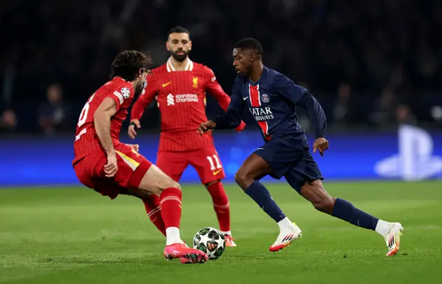 Ousmane Dembele of Paris Saint-Germain (R) tries to get past Dominik Szoboszlai