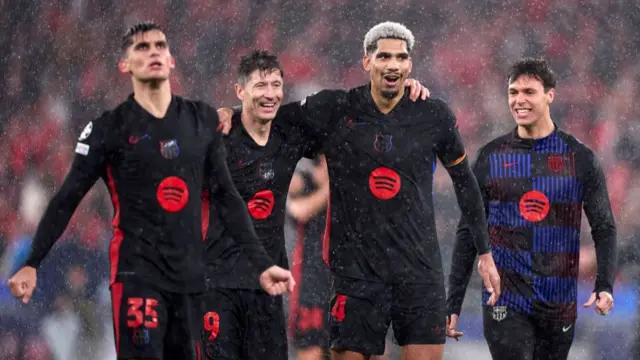 Barcelona players celebrate after victory at Benfica