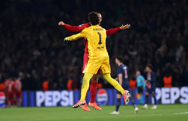 Alisson Becker of Liverpool celebrates with team mate Virgil van Dijk