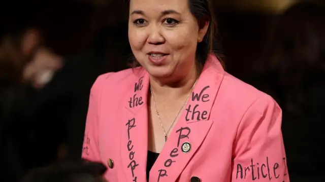 Democratic Congresswoman Jill Tokuda of Hawaii wears a jacket with writing of the U.S. Constitution