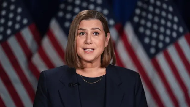 US Senator Elissa Slotkin speaking in front of an American flag