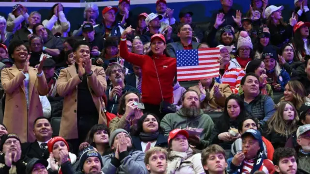 Trump supporters watch him sworn in inside the Capital One Arena, in Washington DC, last month