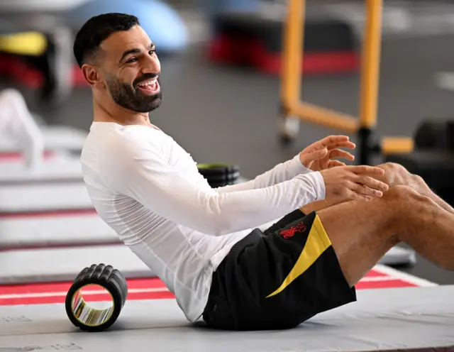 Mohamed Salah smiles at training