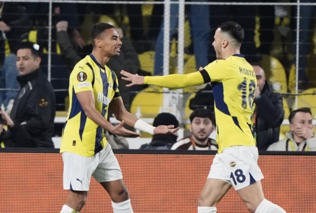 Fenerbahce's Alexander Djiku (left) celebrates