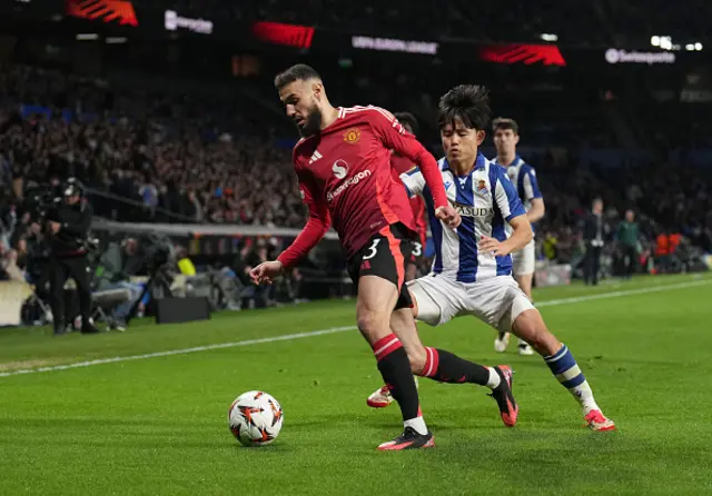 Noussair Mazraoui of Manchester United is challenged by Takefusa Kubo o