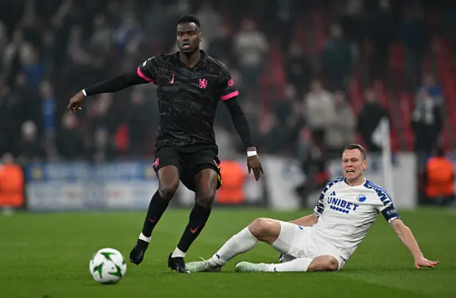 Benoit Badiashile of Chelsea is challenged by Viktor Claesson