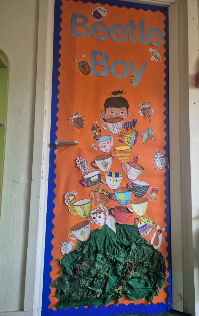A picture of a Beetle Boy poster that school students have made