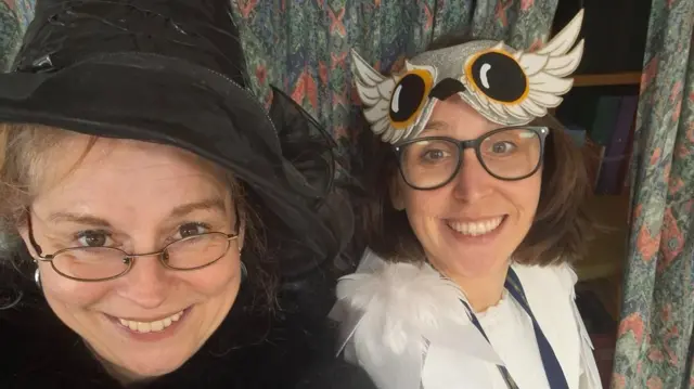A photograph of two teachers dressed as Professor Minerva McGonagall  and Hedwig