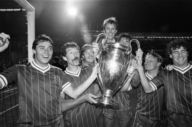 Liverpool squad lift Champions League trophy in 1984