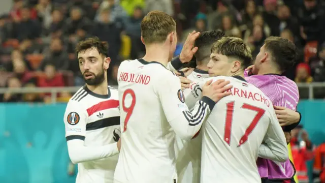 Manchester United players celebrate after scoring against Basel