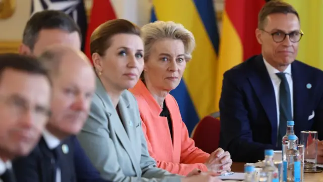 Several European leaders sitting at a table