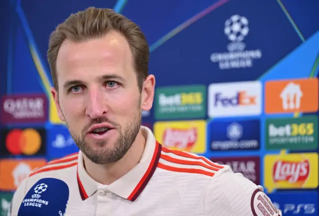 Harry Kane smiles while being interviewed