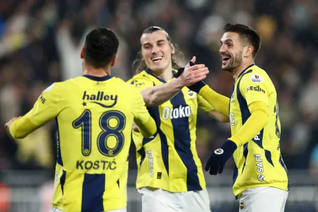 Filip Kostic, Caglay Soyuncu and Dusan Tadic all celebrate together