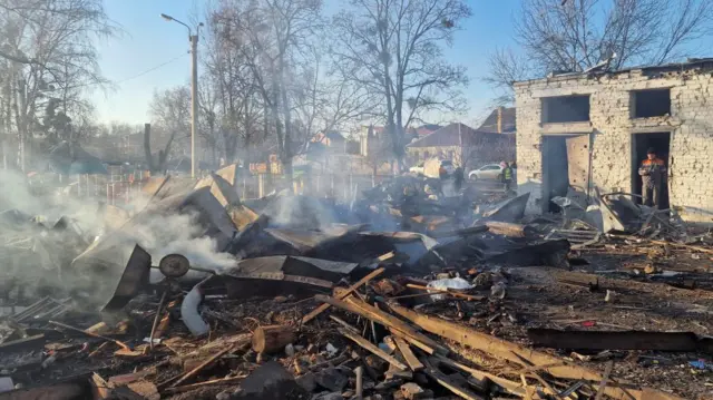 Smoking rubble at the site of a missile strike in Kharkiv