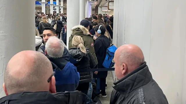 Passengers crowd St Pancras station