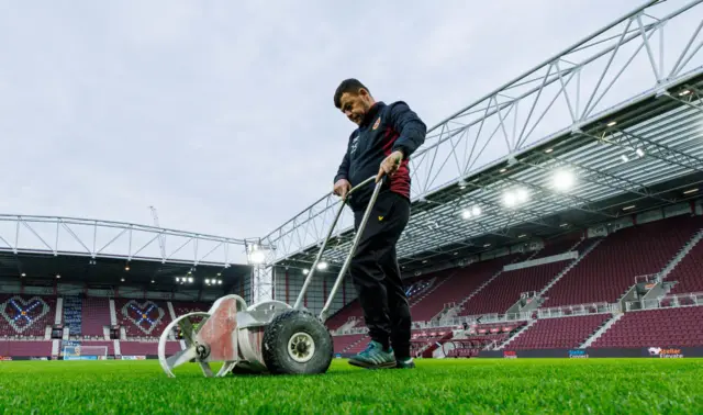 Final preparations to Tynecastle pitch before Hearts v Dundee