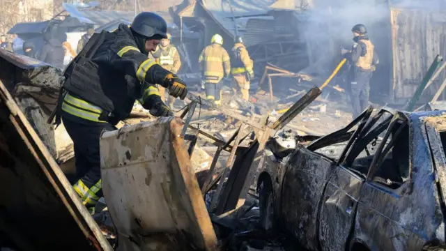 Ukrainian rescuers work at the site of Russian shelling near a residential building in Kharkiv, northeastern Ukraine, 07 March 2025, amid the Russian invasion.