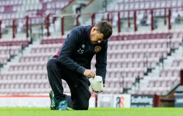 Final preparations to Tynecastle pitch before Hearts v Dundee