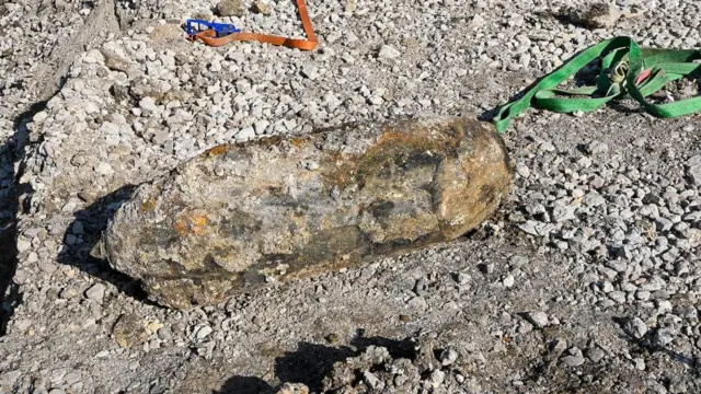 WW2 bomb sits on gravel