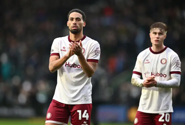 Zak Vyner [left] and Sam Bell [right] applaud the Bristol City fans