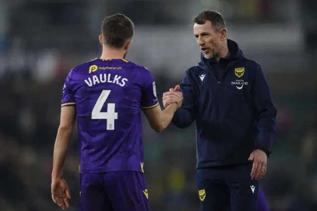 Gary Rowett, Head Coach of Oxford United shakes hands with Will Vaulks of Oxford United