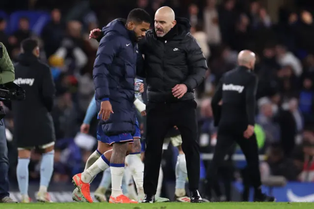 Enzo Maresca the manager of Chelsea talks with Reece James