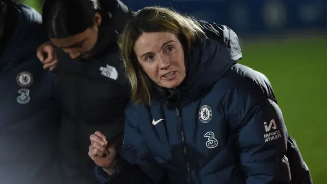 Chelsea manager Sonia Bompastor speaks with her team following the Women's Super League match against Leicester City.