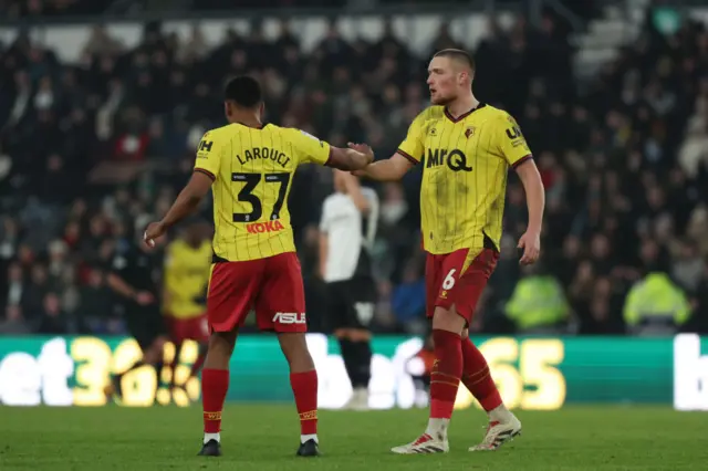 Yasser Larouci and Mattie Pollock of Watford shake hands