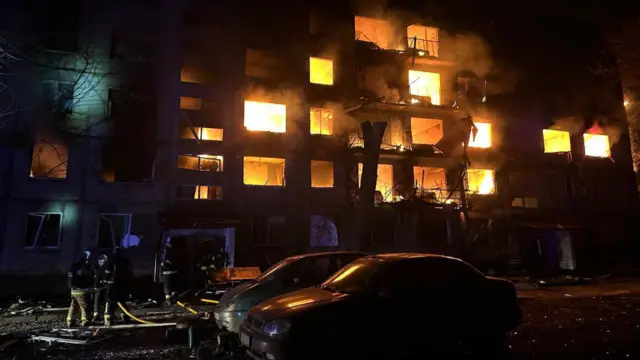 Firefighters tackling a blaze at a building