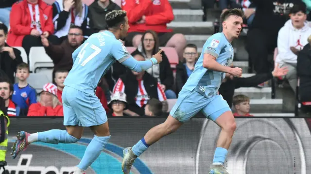 Isaak Davies runs off to celebrate after scoring against Sunderland